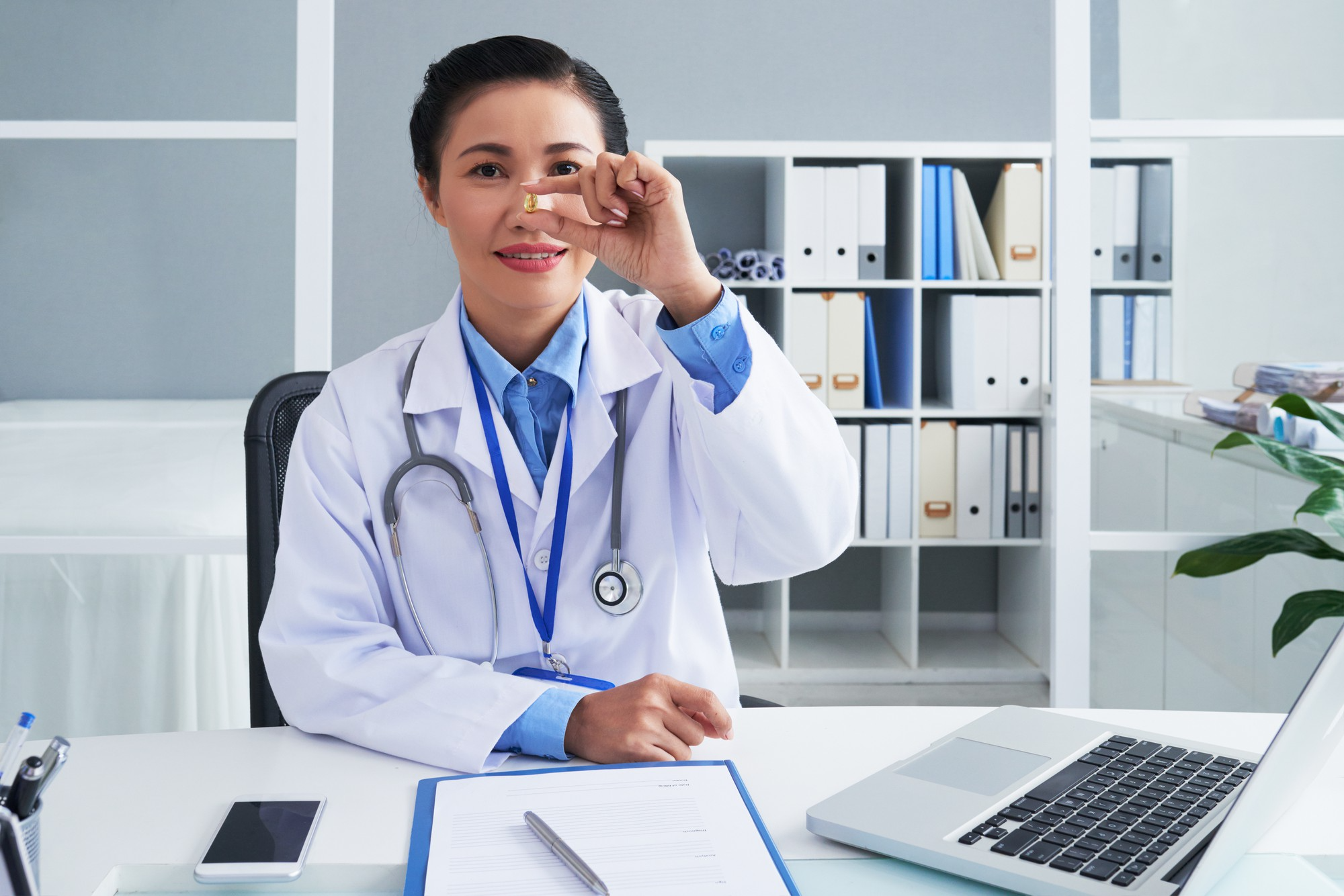 Chinese medical professional at her desk